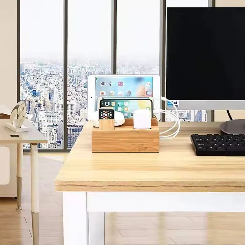 Wooden desk organizer with electronic devices on a wooden desk with a cityscape view.