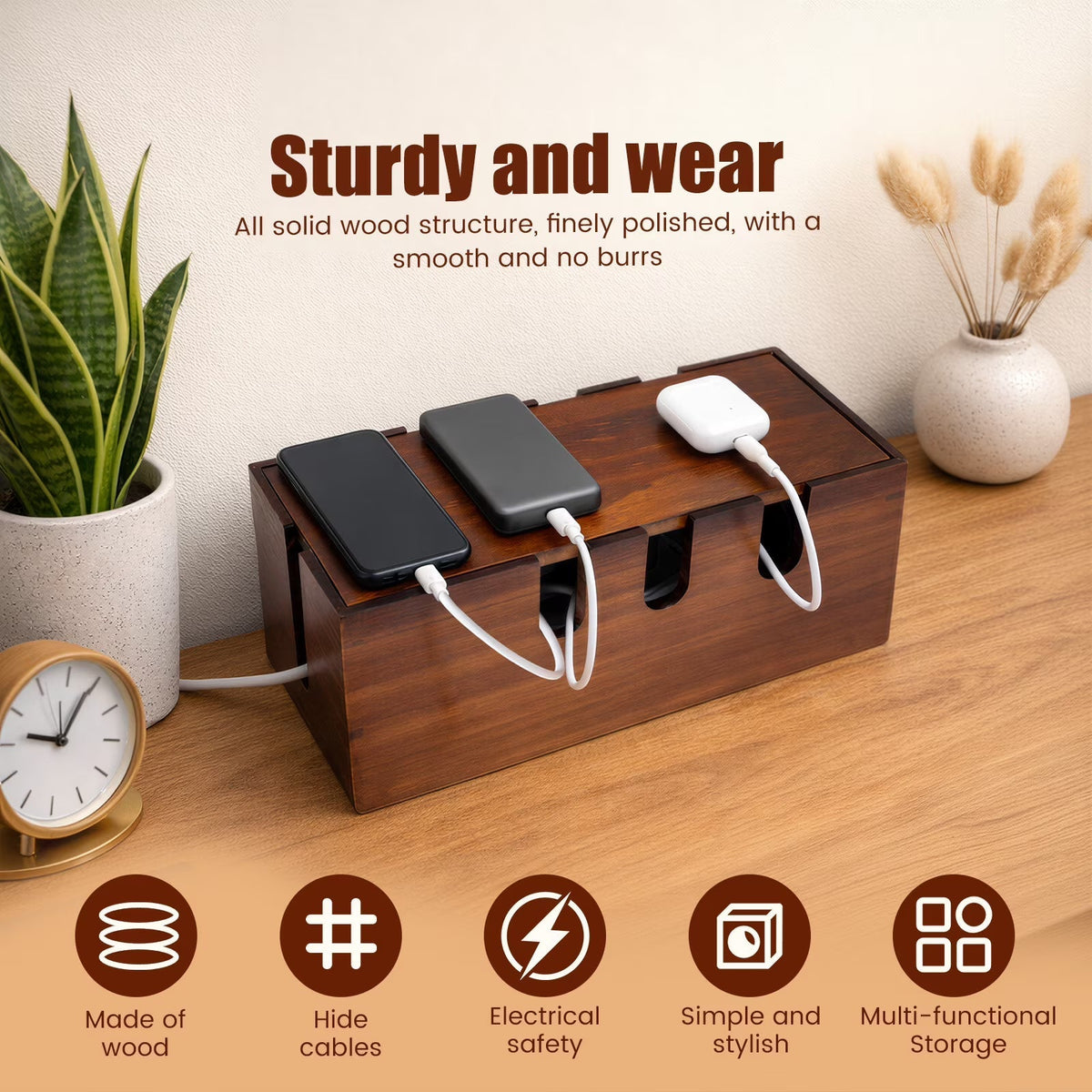 A wooden multi-functional charging dock and cable organizer shown on a tabletop with three charging devices plugged in. The scene includes decorative plants, a clock, a vase, and marketing text reading 'Sturdy and wear' plus feature icons along the bottom.