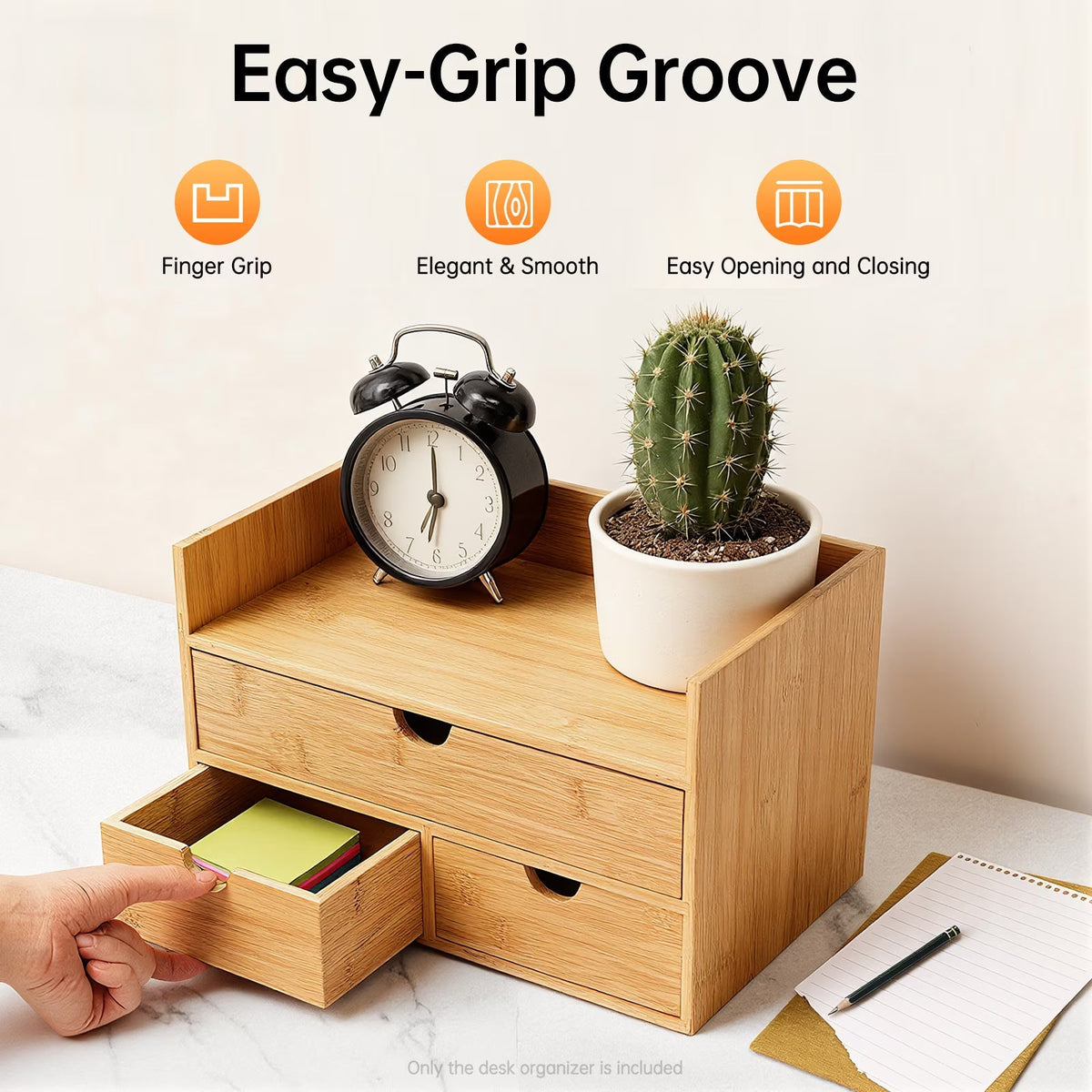 Wooden desk organizer with a clock, plant, and notes on a marble surface.