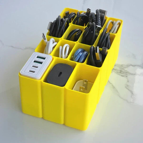 Yellow charging station with multiple ports and cables on a light background