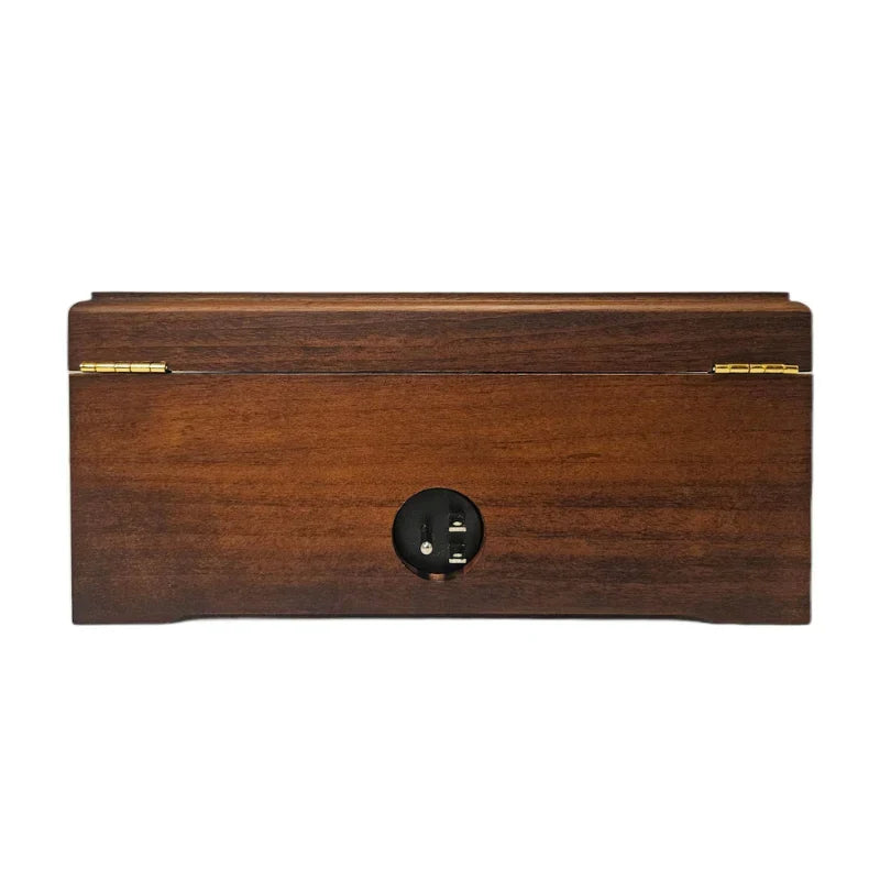 Wooden jewelry box with a metallic clasp on a white background