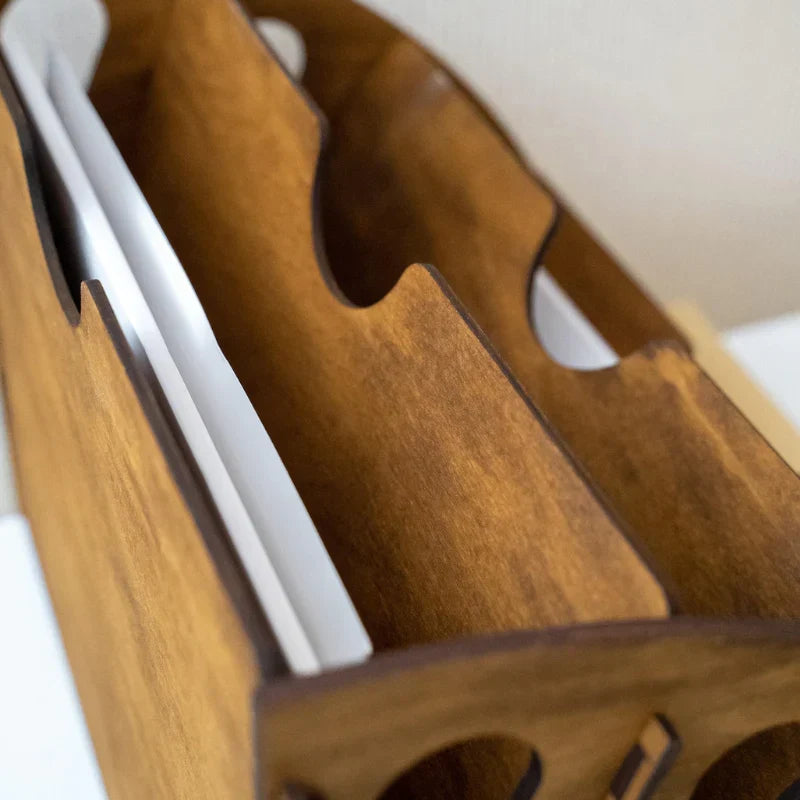 Wooden bottle holder with multiple slots on a white background
