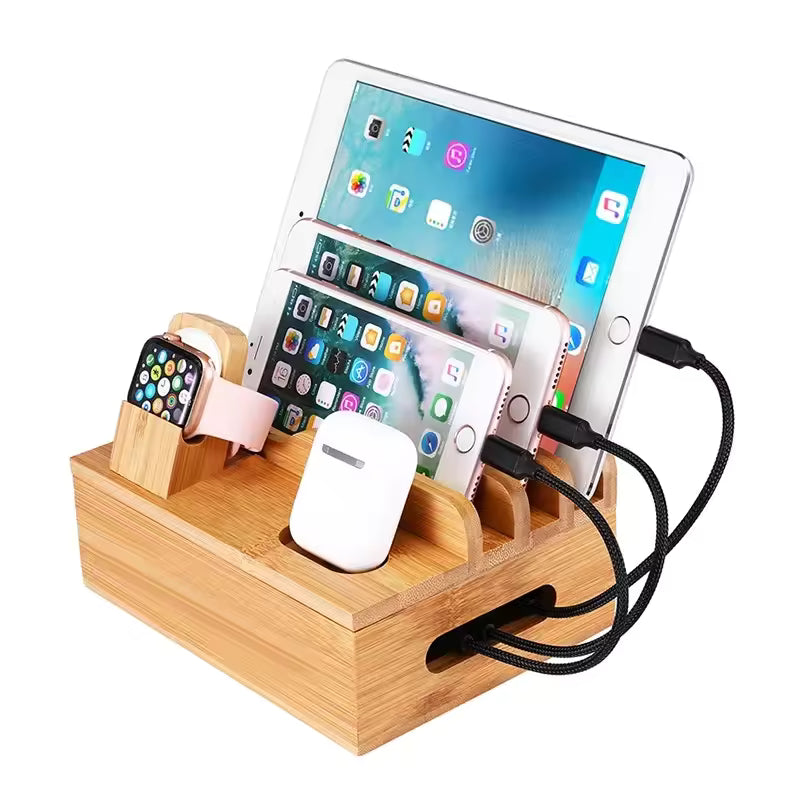 Wooden charging station with multiple electronic devices on a white background