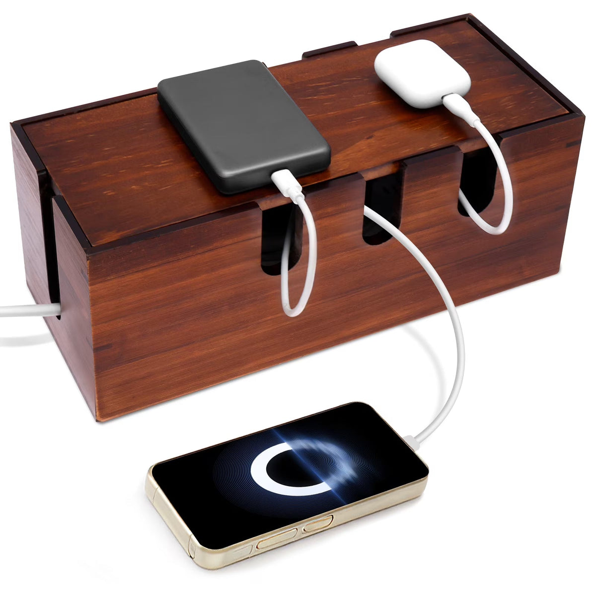A rectangular wooden charging dock with multiple cable ports, shown on a white background with a black power bank, white earbud charging case, and a smartphone receiving wireless charging.